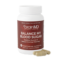 BrainMD Balance My Blood Sugar: brown supplement bottle with capsules against a transparent background