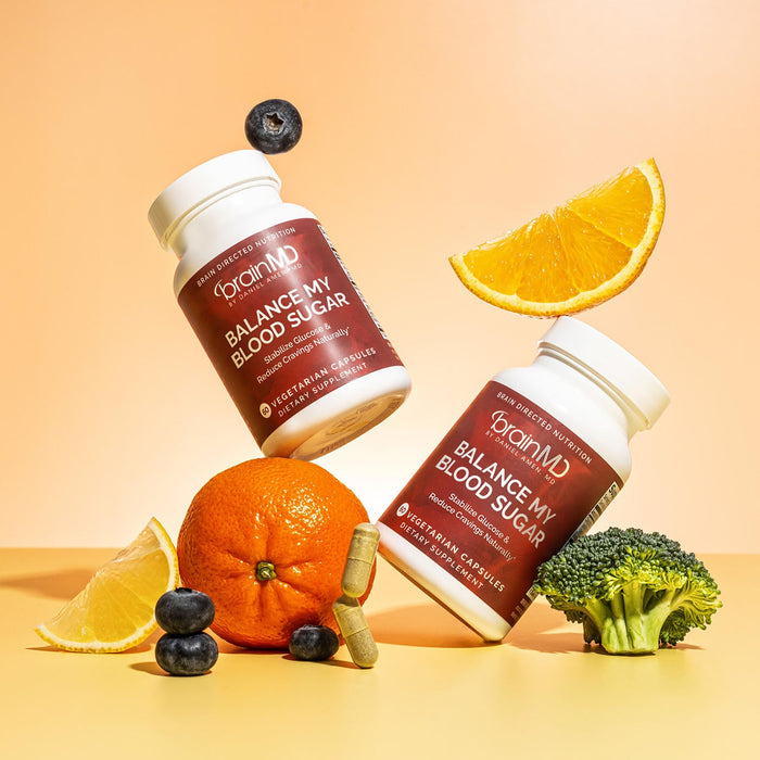BrainMD Balance My Blood Sugar: infographic, two angled supplement bottles surrounded by capsules, fruits and vegetables