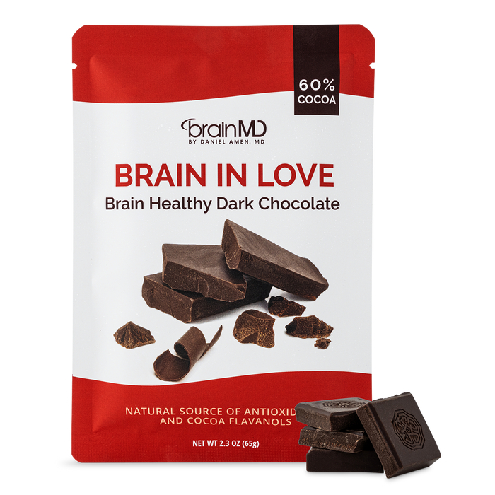 BrainMD Brain In Love Chocolate: image of chocolate bar wrapper with sample squares against a transparent background
