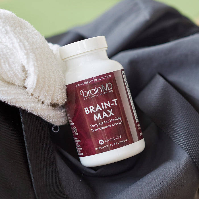 BrainMD Brain-T MAX: brown supplement bottle resting on a black tote bag
