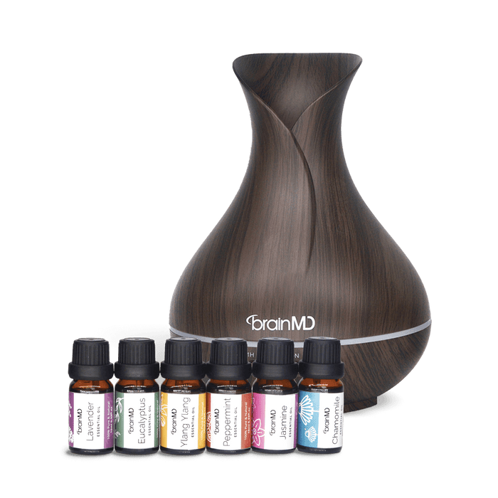 BRIGHT MINDS Diffuser with 6 essential oils bottles against a transparent background.