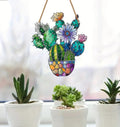 Cactus Stained Window Hanging with succulents on windowsill.