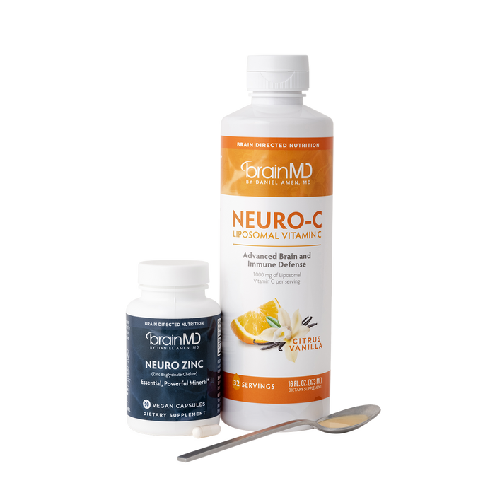 BrainMD Everyday Immunity Bundle: short gray bottle and tall orange & white bottle against a transparent background