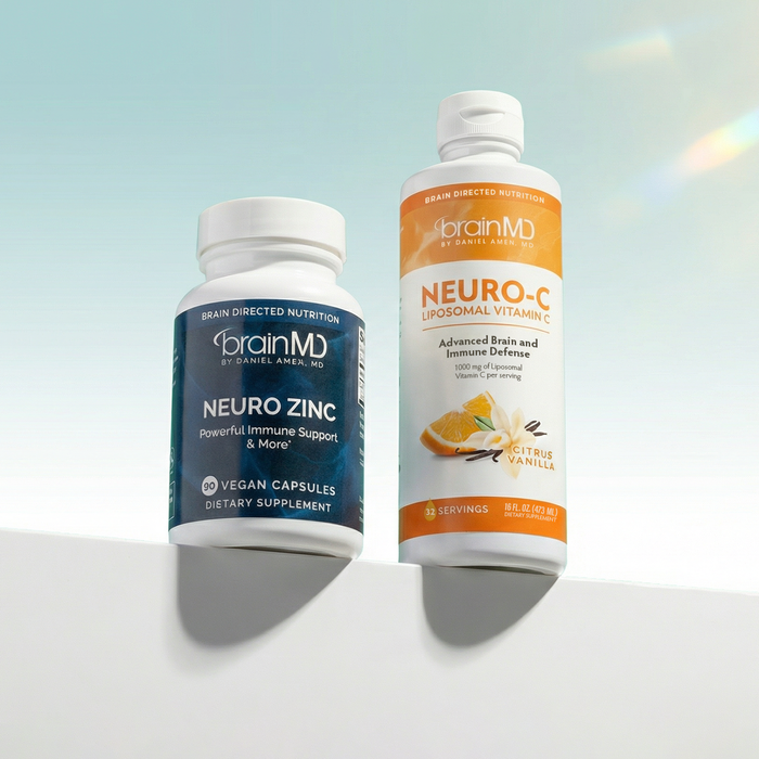 Short and tall supplement bottles against a powder blue background. Square shape.