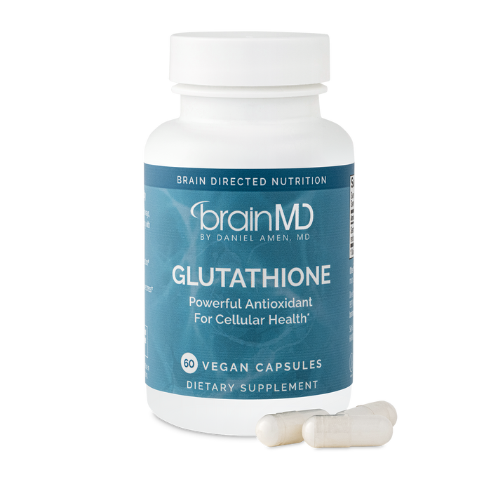 BrainMD Glutathione: blue supplement bottle with capsules at the base against a transparent background