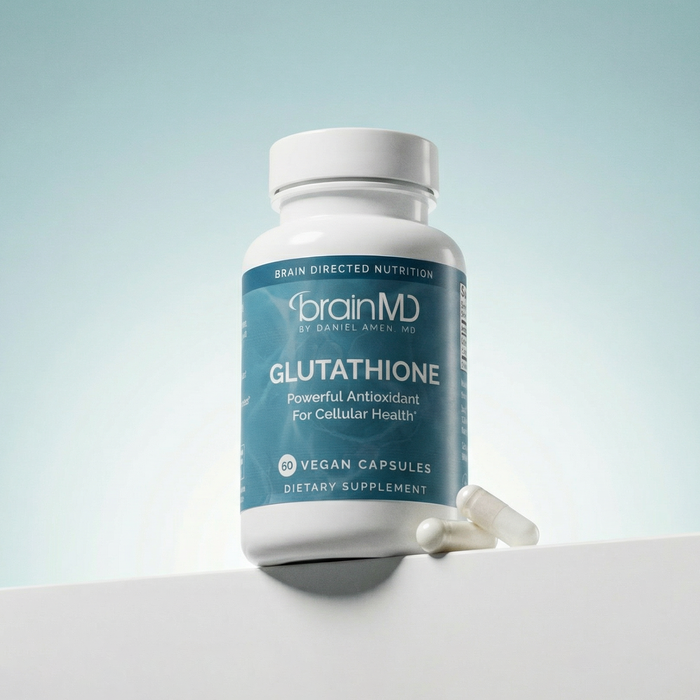 Blue supplement bottle with capsules at the base against a light blue background.