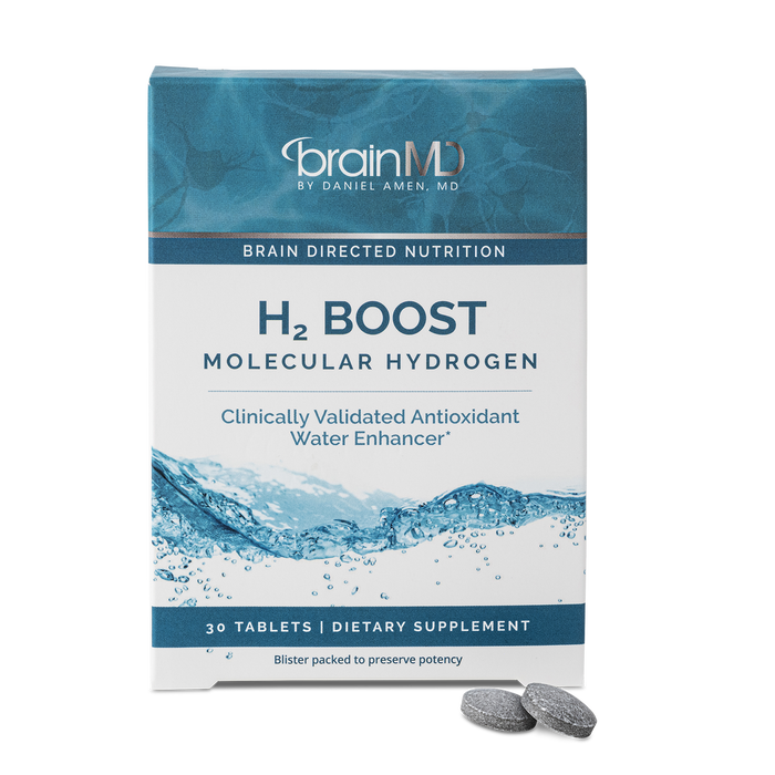Blue supplement box with gray tablets at the base against a transparent background.