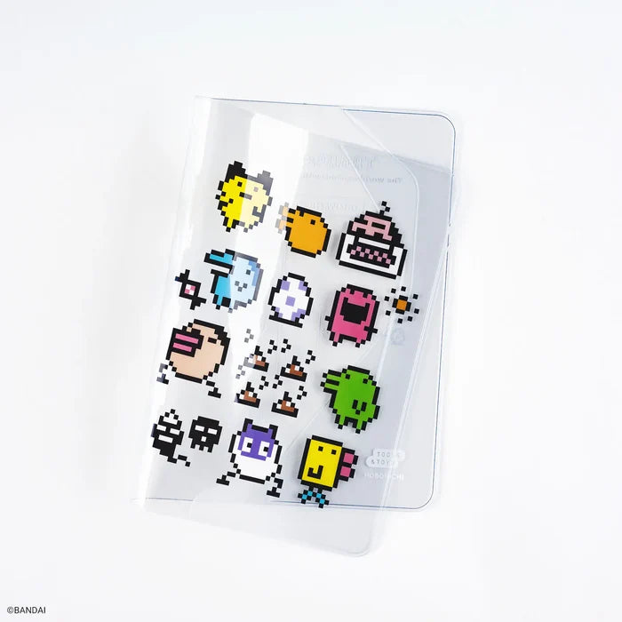 Hobonichi 2026 A6 Planner Cover: Tamagotchi - Cover on Cover for A6 Size (Growth Chart!), shown from another angle.