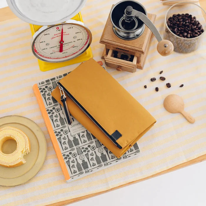 Hobonichi 2026 Weeks Planner Cover: Tragen - Mustard, detail view of the design.