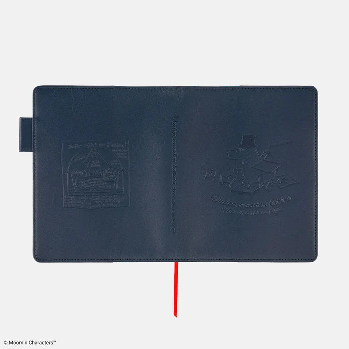 The back of the cover, the embossed line drawing catching the light