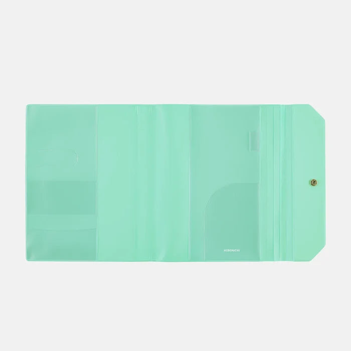 The inside of the cover, plain mint with clear pockets front and back