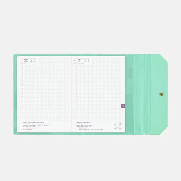 The cover wrapped around an open A5 Cousin techo, showing a daily spread