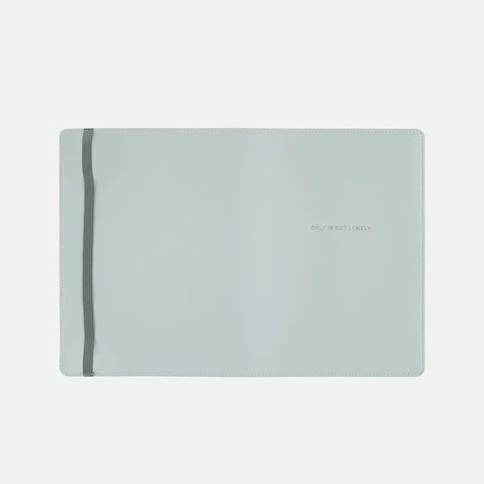 The cover opened out flat, the soft blue running unbroken across the panel