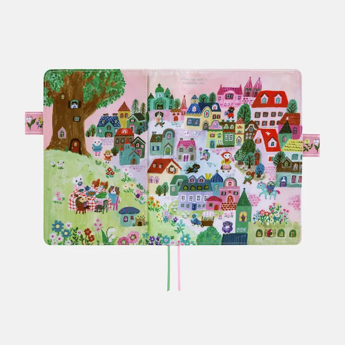 The cover opened out flat, the whole village panorama running across both panels