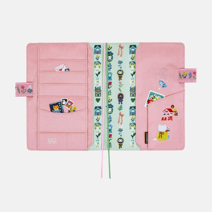 The inside of the cover in soft pink, the card slots printed with little figures