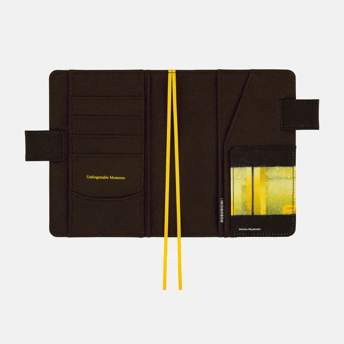 Inside the cover: card slots on the left printed with Unforgettable Moments in gold, an artwork-lined pocket on the right