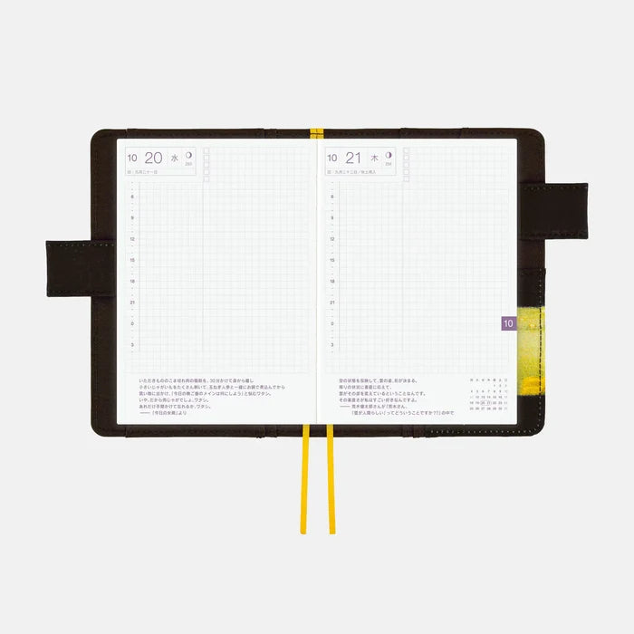 The cover wrapped around an open A6 techo, showing a daily spread