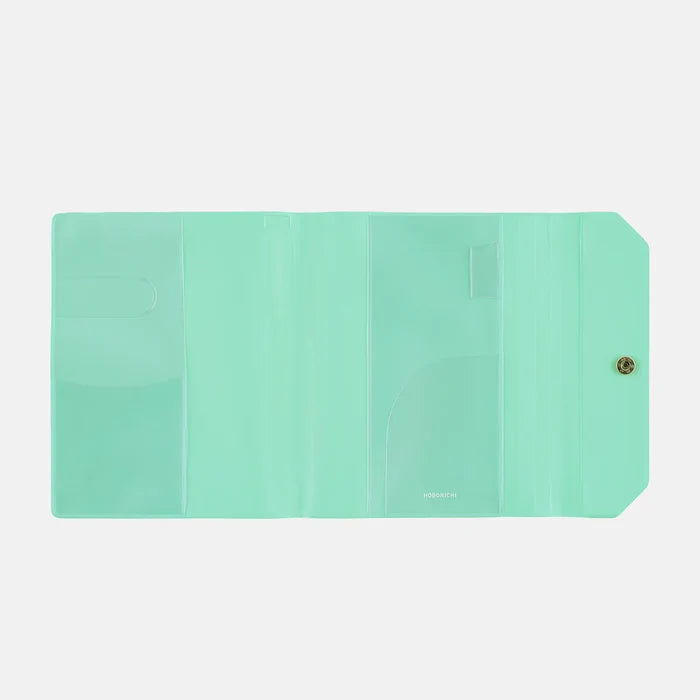The inside of the cover, plain mint with clear pockets front and back