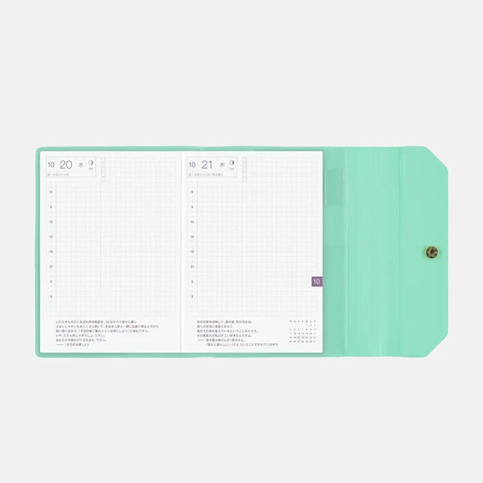 The cover wrapped around an open A6 techo, showing a daily spread