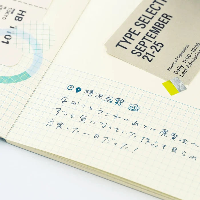 An open techo page of handwritten notes with a printed slip taped in alongside