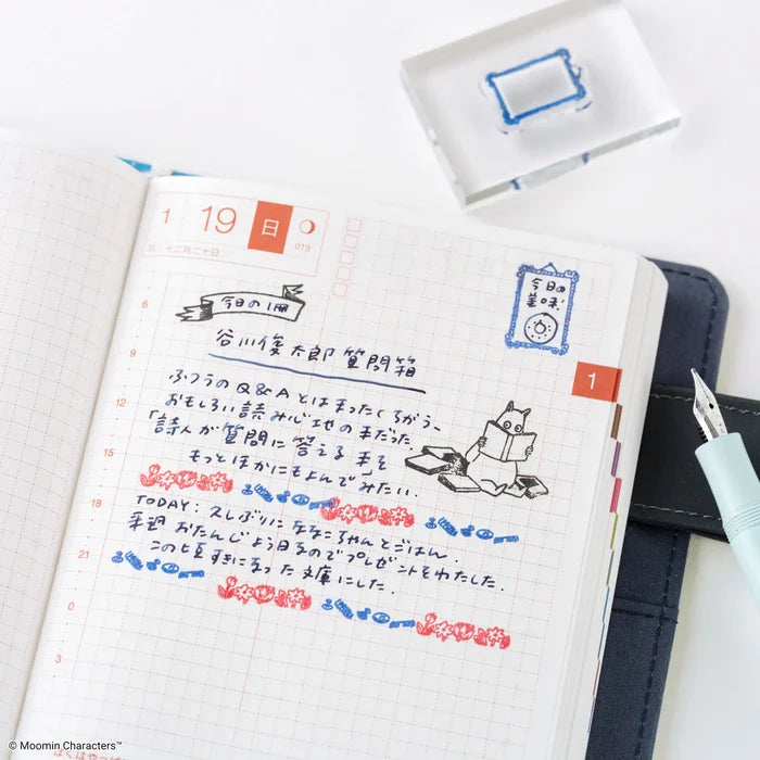 An open techo with stamped blue frames drawn around handwritten notes