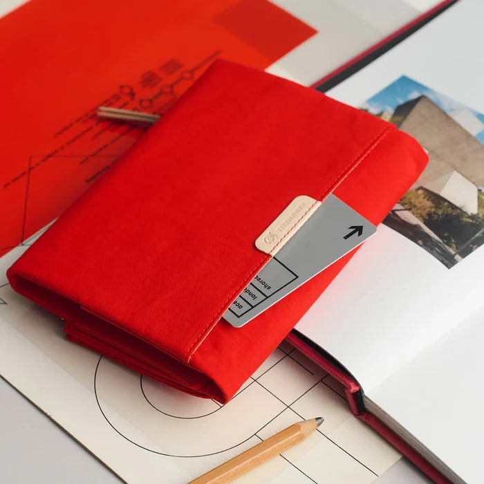 Hobonichi 2026 A6 Planner Cover: Tragen - Red, close-up view.