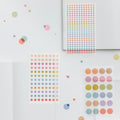 Hobonichi 2026 Accessories: TSUKI no IRO - Transparent Dot Stickers (3.5mm), shown from the front.