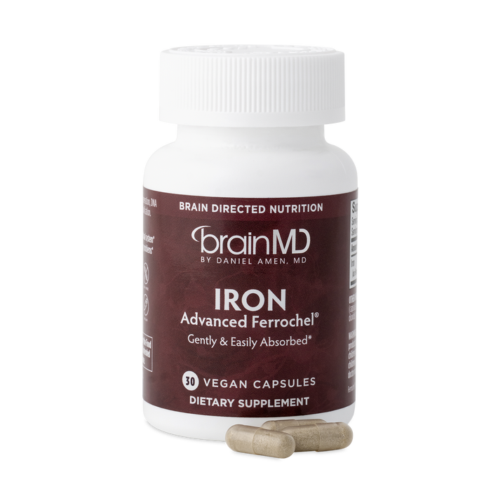 BrainMD Iron: brown supplement bottle with capsules at the base against a transparent background