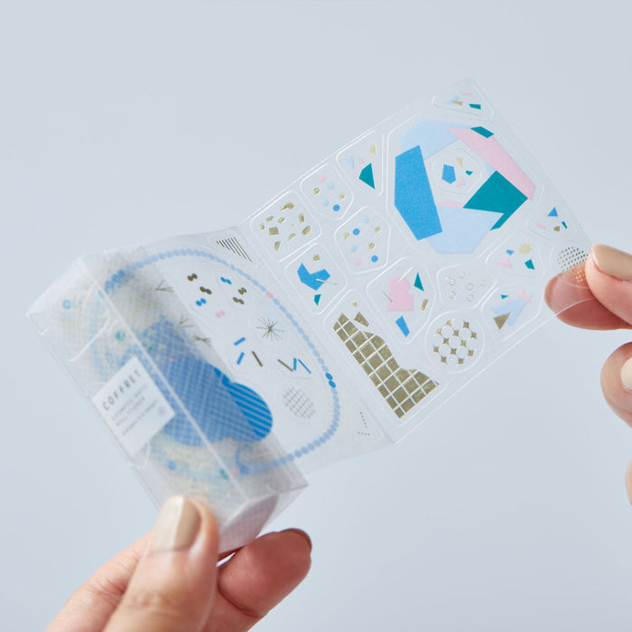 Detailed view of HITOTOKI Coffret cosmetic film roll sticker surface and translucent design.