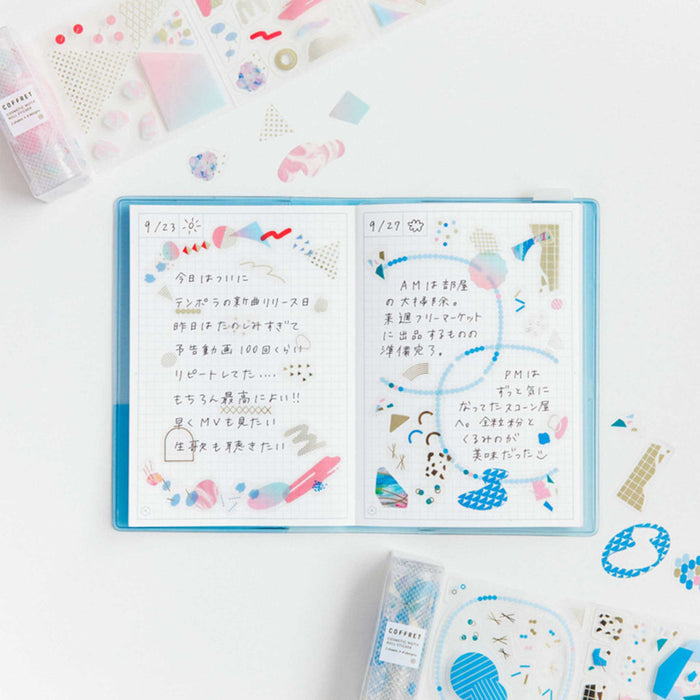 HITOTOKI Coffret cosmetic film roll stickers used to decorate an open journal and notebook spread.