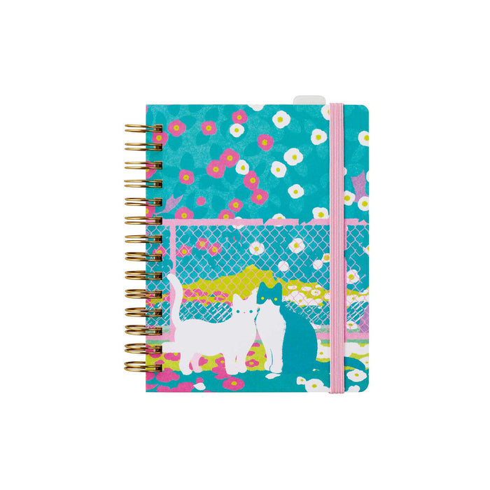 HITOTOKI passport size ring notebook with blue illustrated patterned cover.