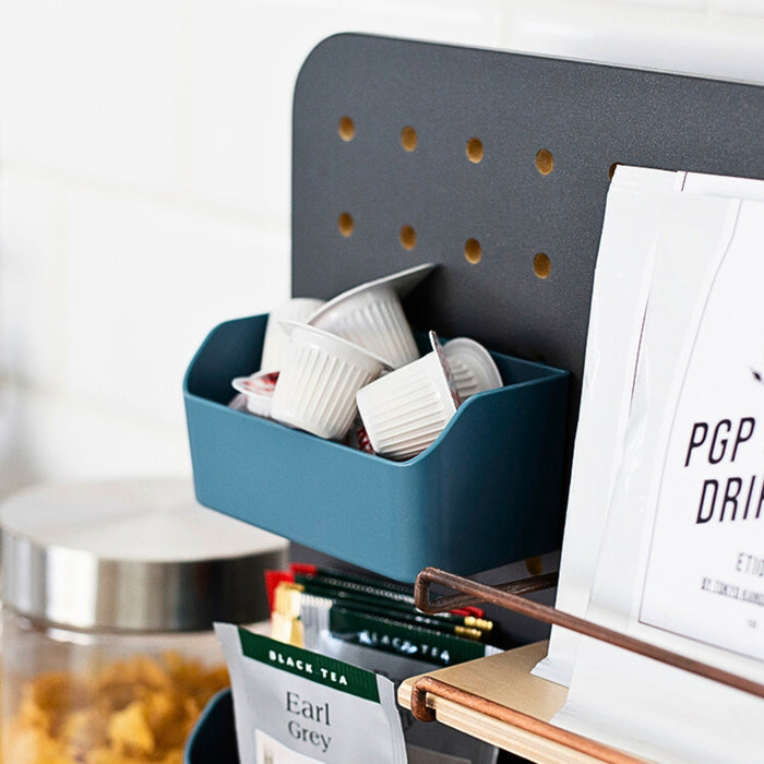 PEGGY accessories mini container holding small items and mounted on a pegboard.