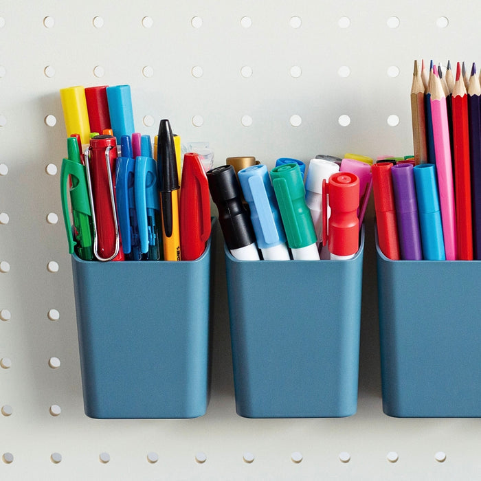 PEGGY Accessories blue pen stand holding colourful pens, mounted on a pegboard organiser.