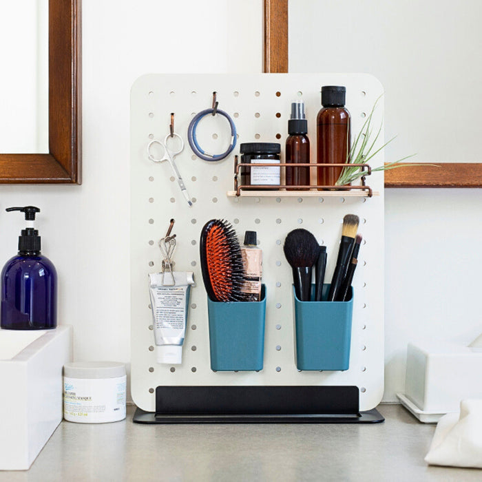 PEGGY Accessories pen stand used in a home office pegboard setup with bottles and desk accessories.