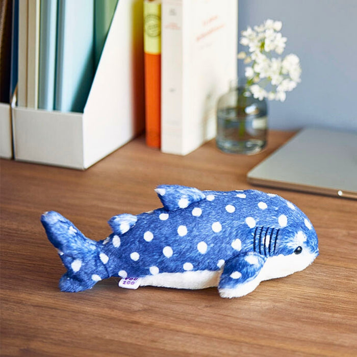 Blue spotted whale shark Pouzoo animal design cushion pouch on a wooden surface.