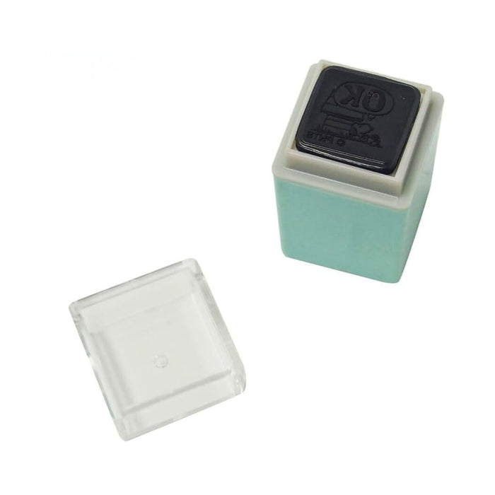 Kodomo No Kao Snoopy mini pom stamp shown with removable protective lid.