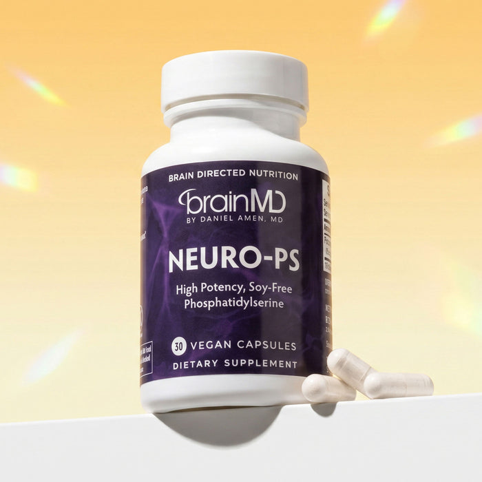 Purple supplement bottle with white capsules at the base against a canary background.