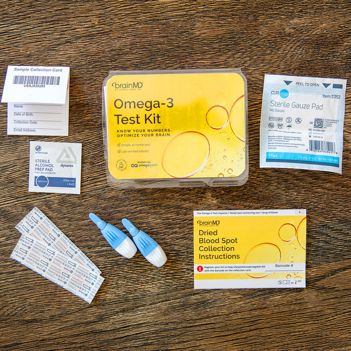 Everything included in the BrainMD Omega-3 Test Kit: sample collection card, lancets, alcohol wipe, gauze pad, bandages, instructions, and prepaid return envelope