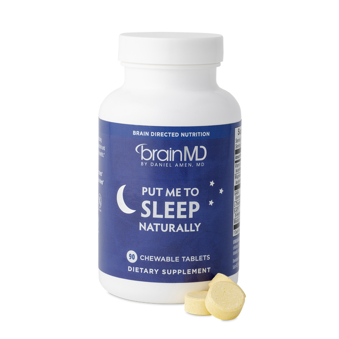 BrainMD Put Me To Sleep Naturally: purple supplement bottle with tablets at the base against a transparent background