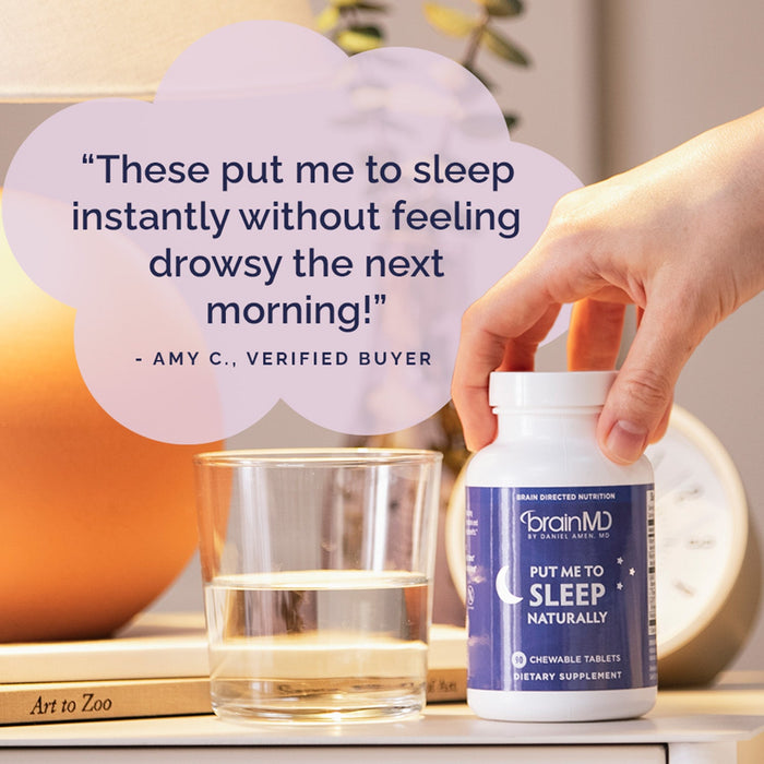 BrainMD Put Me To Sleep Naturally: infographic, purple supplement bottle on a nightstand next to a customer review