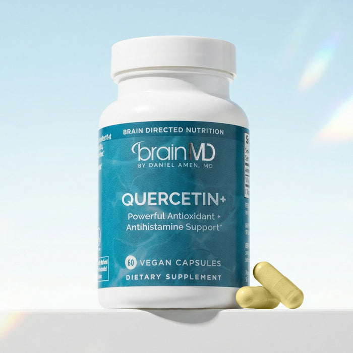 Blue supplement bottle with yellow capsules at the base against a light blue background.