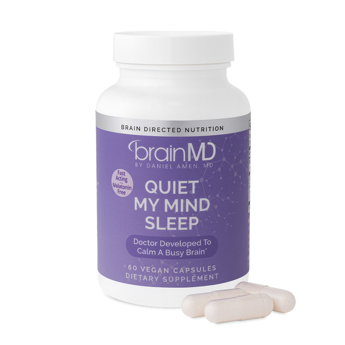 BrainMD Quiet My Mind Sleep: image of bottle and three capsules at its base with transparent background