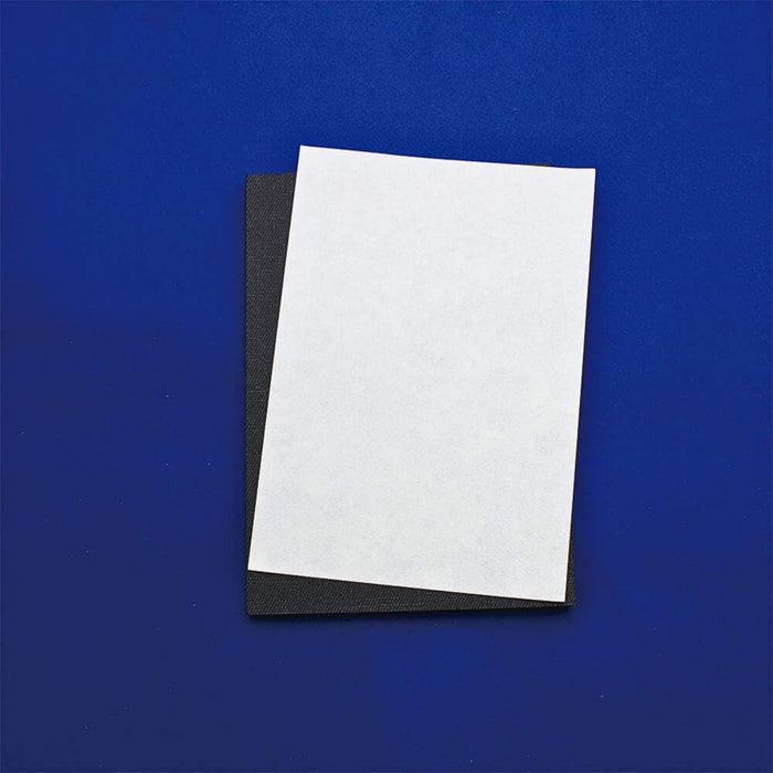 Single folded sheet of Sakae Washi blotting paper displayed against a blue background.