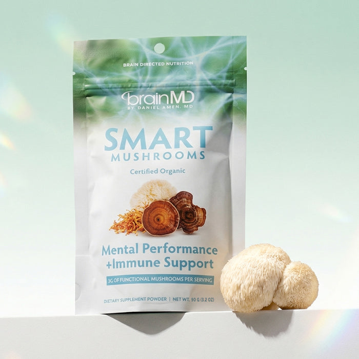 Green supplement bag with white mushroom at the base against a mint green background.