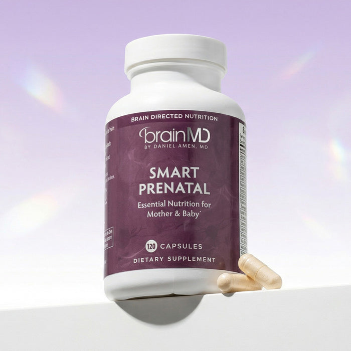 Purple supplement bottle with white capsules at the base against a lavender background.