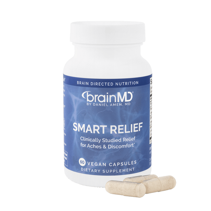 Blue supplement bottle with white capsules against a transparent background.