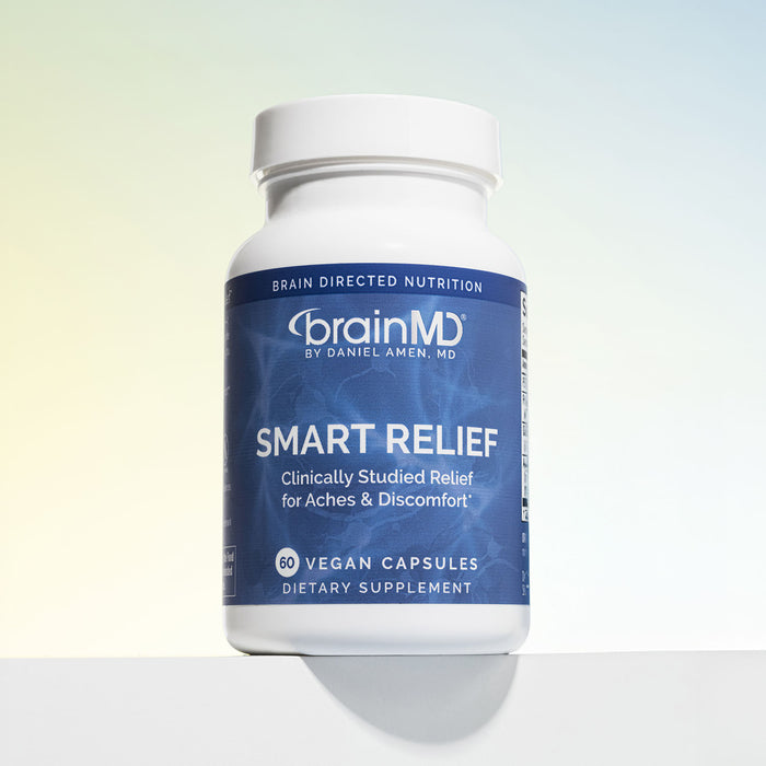 Blue supplement bottle against a light blue background.