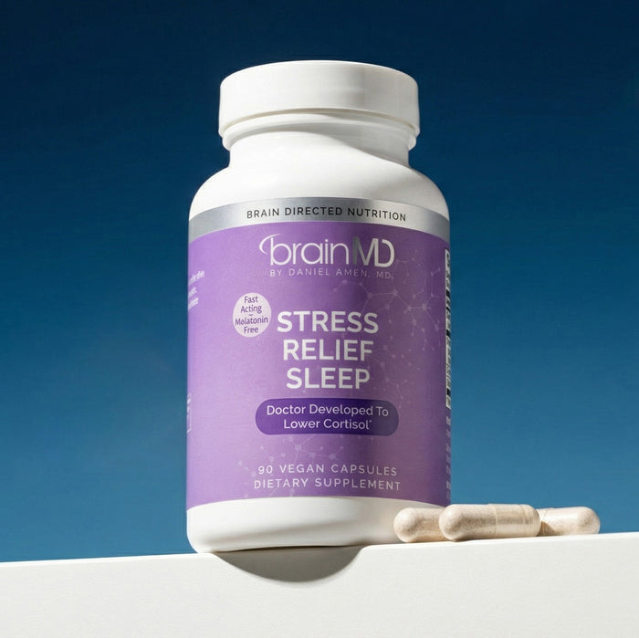 Purple supplement bottle with white capsules at the base against a dark blue background.