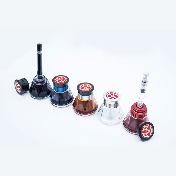 TWSBI Diamond 50 ink bottles 50ml with filling accessories displayed.