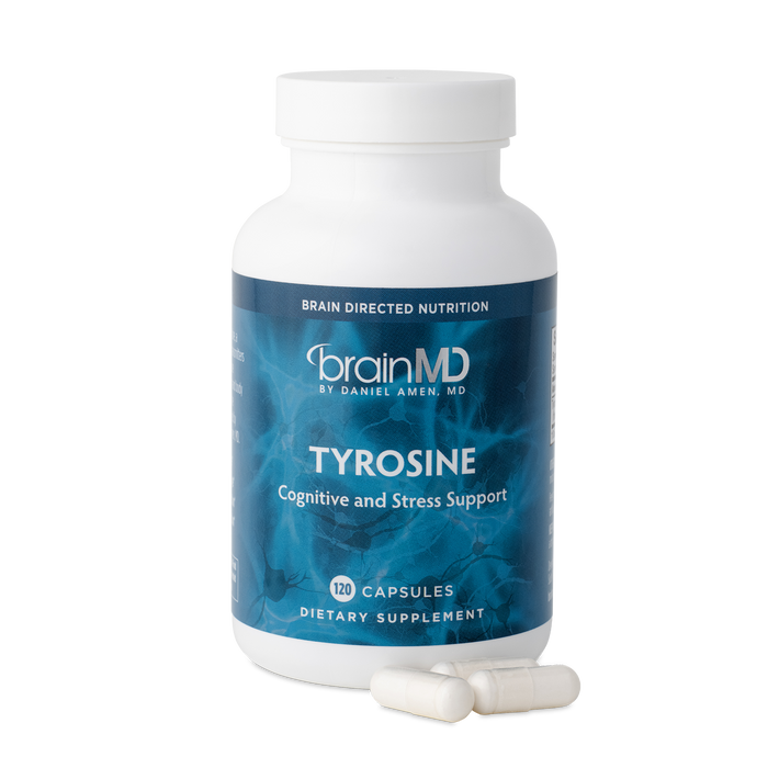 BrainMD Tyrosine: image of blue bottle and three white capsules at its base with transparent background
